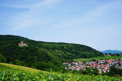 Scenic view of town by buildings against sky