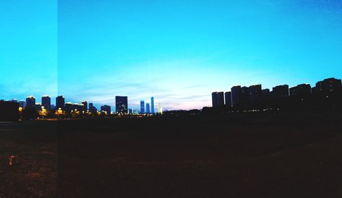 Cityscape against clear blue sky