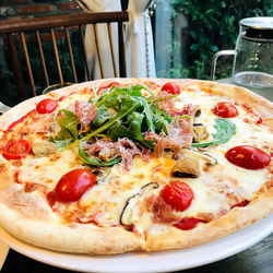 Close-up of pizza served on table