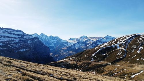 Scenic view of snowcapped mountains against sky