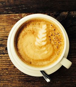 Directly above shot of coffee cup on table