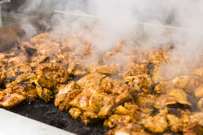 Close-up of meat on barbecue grill