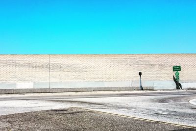 View of road against clear blue sky