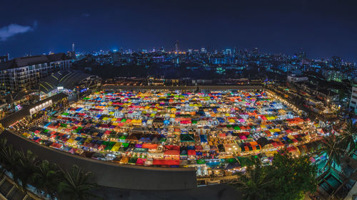 Aerial view of illuminated market and city at night