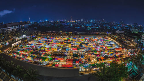 High angle view of illuminated buildings in city at night