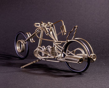 Motorcycle made of wire with a dark background