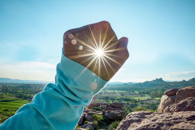 Sunlight streaming through hand