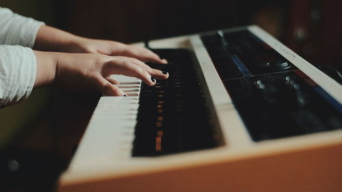 Close-up of person playing guitar