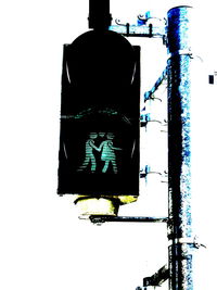 Low angle view of road signal against clear sky