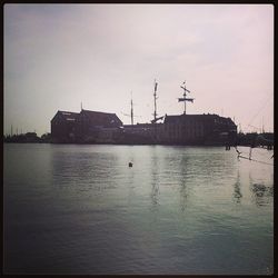 Boats moored at harbor