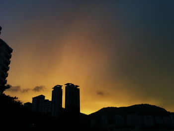 Low angle view of building at sunset