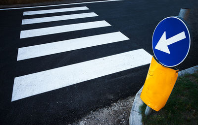 High angle view of arrow sign on road