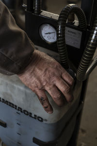 Close-up of hand holding clock