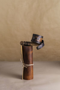 Composition of leather bracelet, roll of leather, tool for processing leather, natural background