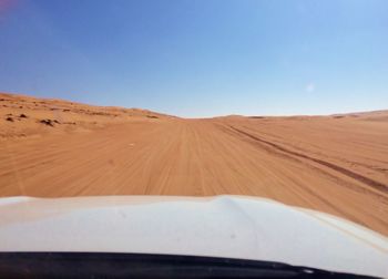 Scenic view of desert against clear sky