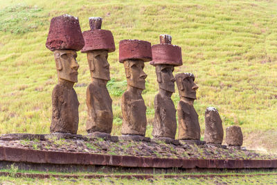 Stone sculpture on grass