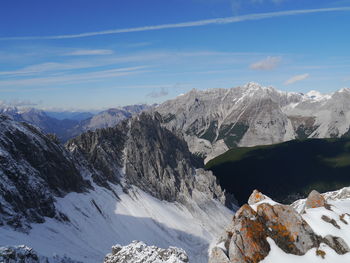 Scenic view of snowcapped mountains against sky