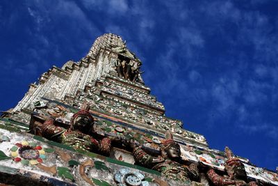 Low angle view of buddhist temple against blue sky