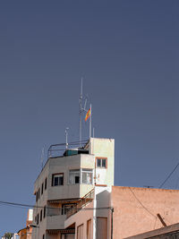 Low angle view of buildings against clear sky