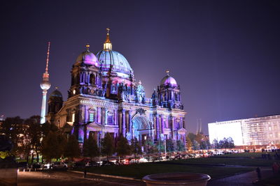 Illuminated buildings in city at night