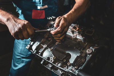 Midsection of man working in workshop