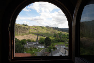 Scenic view of landscape seen through window