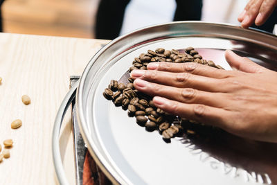 High angle view of person preparing food in plate