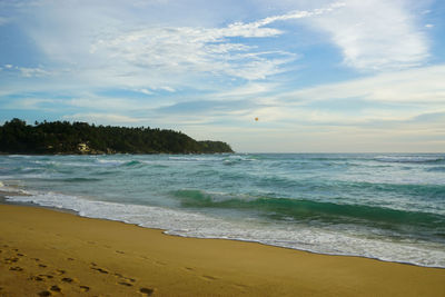 Scenic view of beach against sky