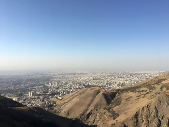 High angle view of cityscape against clear blue sky