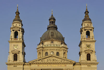 Low angle view of church against clear blue sky during sunset