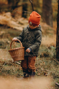 Rear view of man working in basket