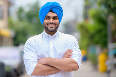 Portrait of young man standing outdoors