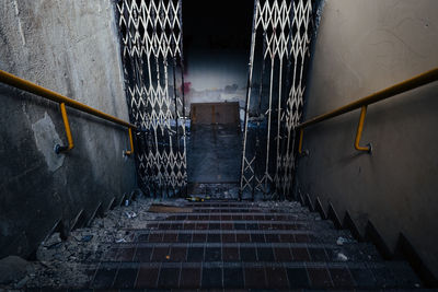 View of staircase in narrow walkway