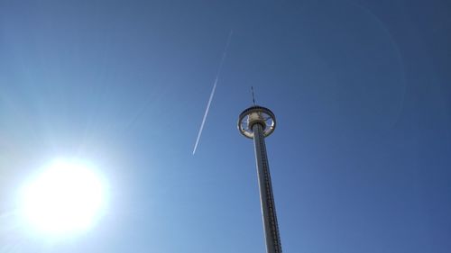 Low angle view of airplane against clear sky. seto-ohashi tower, sakaide japan