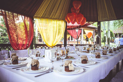 Lanterns hanging on table in restaurant