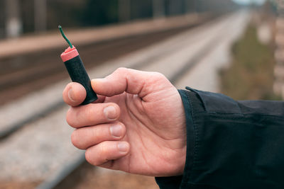 Close-up of man holding hands
