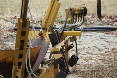 Yellow farm machinery on field