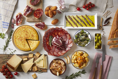 Spanish tapas. a table with typical spanish food seen from above.  tasty food.