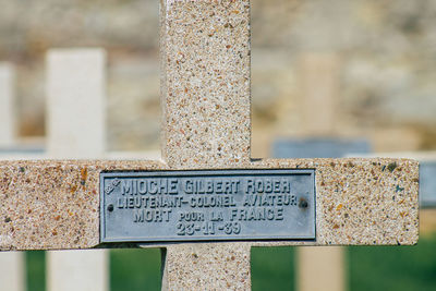 Close-up of text on rusty metal