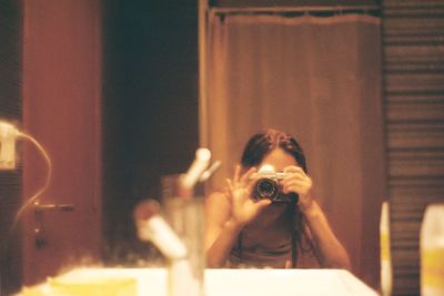Portrait of woman photographing