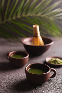 Matcha green tea in a ceramic mugs