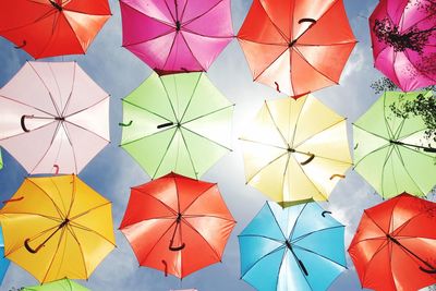 Directly above shot of multi colored umbrellas against sky