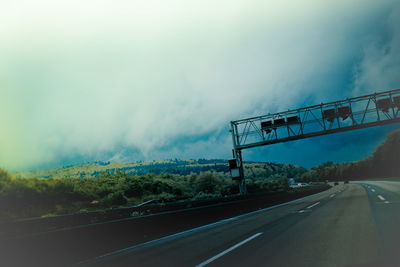 View of road against cloudy sky