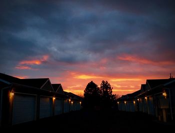 Silhouette trees against sky during sunset