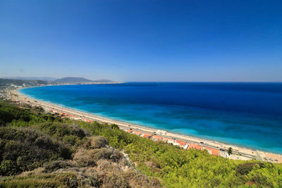 High angle view of bay against clear blue sky