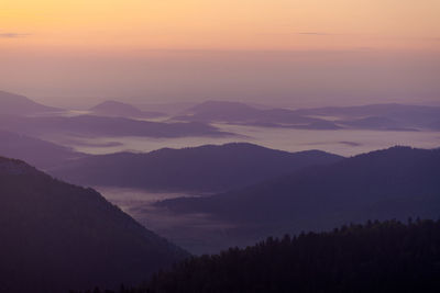 Scenic view of mountains against sky during sunset