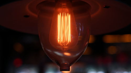 Close-up of illuminated light bulb