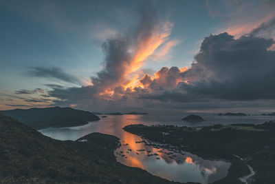 Scenic view of lake against sky during sunset