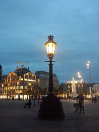 People walking on street at night