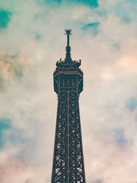 Low angle view of historical eiffel building against cloudy sky